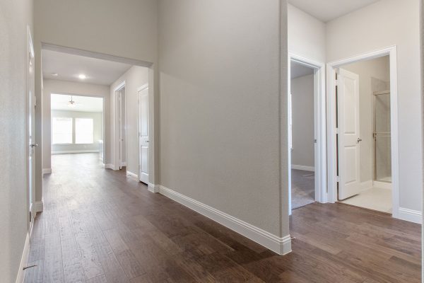 Landon Homes new home builder 515 Sherwood Hallway with white walls and wooden floors