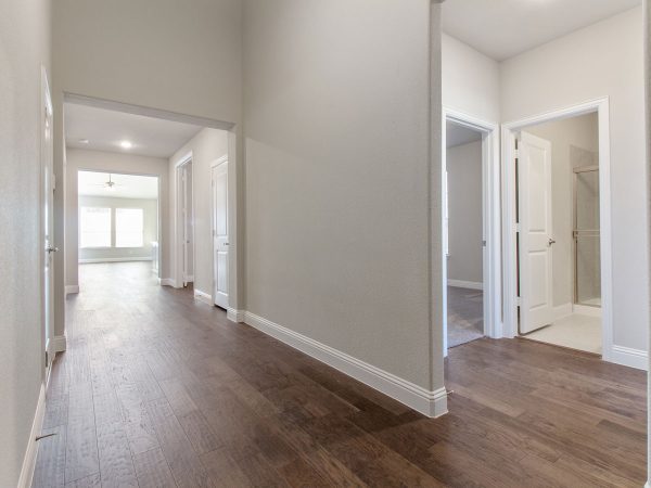 Landon Homes new home builder 515 Sherwood Hallway with white walls and wooden floors