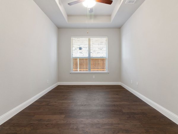Landon Homes new home builder 515 Sherwood Study with white walls and wooden floors