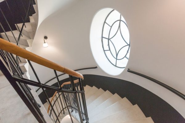 How to Decorate Your Curved Staircase